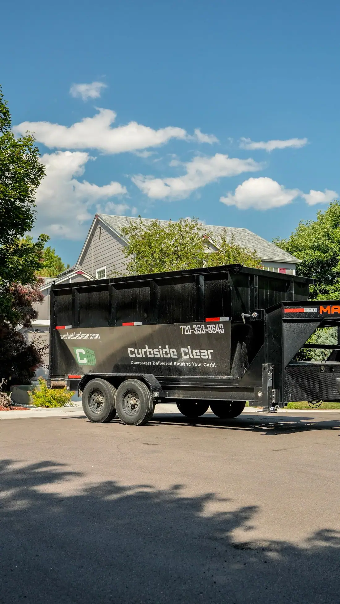 Curbside Clear roll-off dumpster ready for pickup