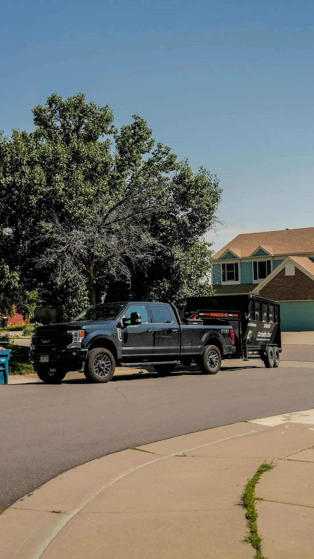 Curbside Clear truck and trailer on an Arvada street